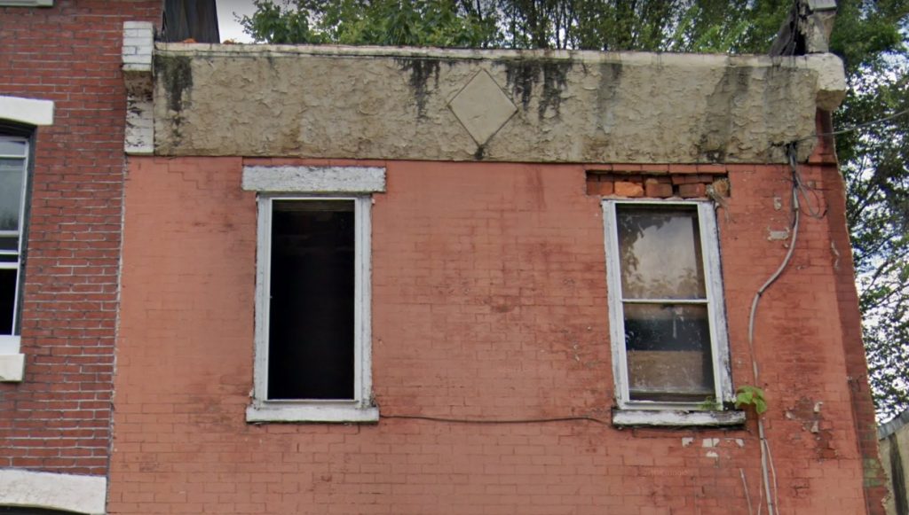 Façade damage at 1019 West Dauphin Street. Credit: Google