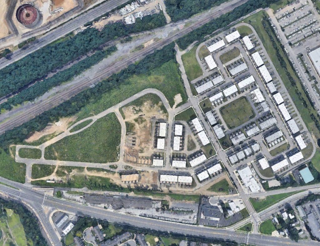 Aerial view of Siena Place. Note completed homes on right side of image, with area on lectern side remaining untouched. Credit: Google.