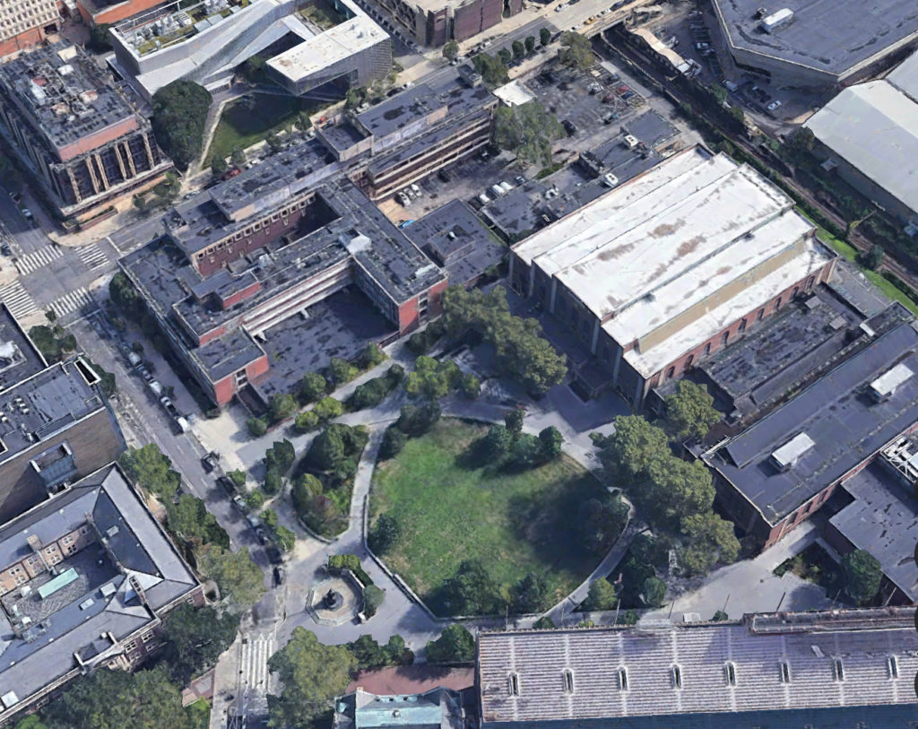 Aerial view of the project site (on upper right corner of block). Credit: Google.