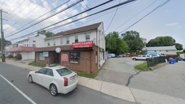 7037 Ridge Avenue prior to redevelopment. Looking north. July 2021. Credit: Google Street View