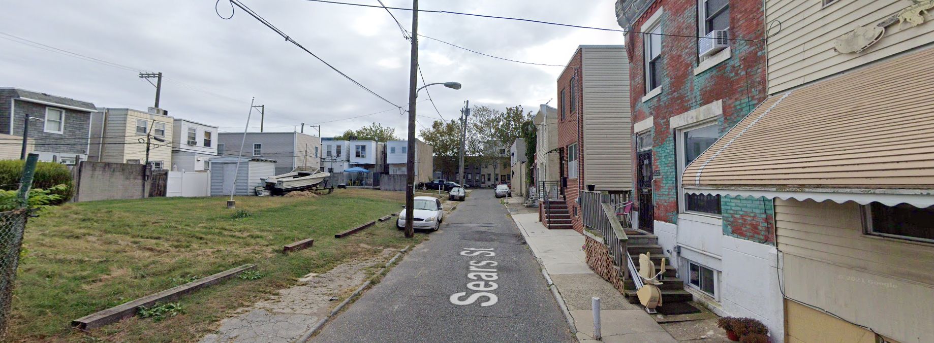 Sears Street, with 3618 Sears Street on the right. Site conditions prior to redevelopment. Looking east. October 2019. Credit: Google Maps